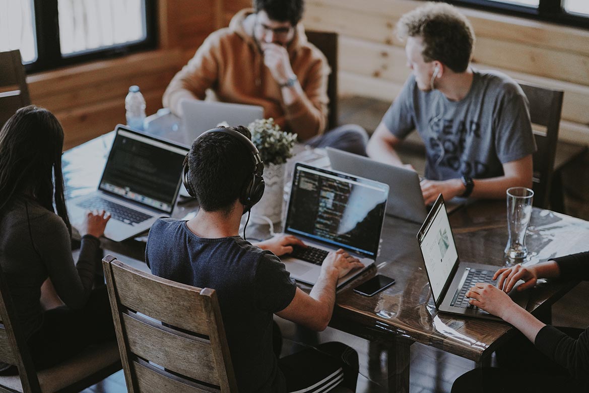 image of students looking at a computer