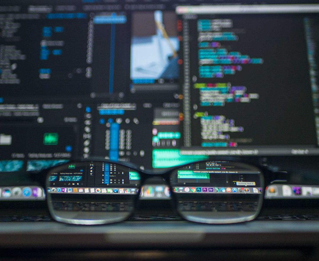 An image of glasses and a computer screen